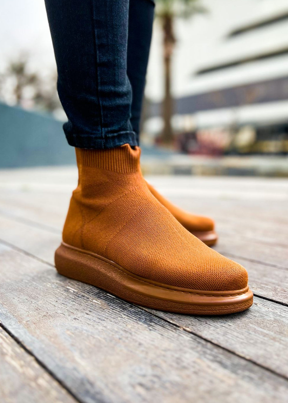 Torino X Espresso Essence knit slip-on ankle boot in brown by Apollo Moda, worn on city pavement